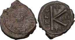 Maurice Tiberius (582-602). AE Half Follis. Thessalonica mint. Dated RY 3 (584/5). Helmeted and cuirassed bust facing, holding globus cruciger and shi...
