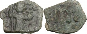 Constans II (641-668). AE Follis, Constantinople mint. Emperor standing facing, crowned, holding long cross and globus cruciger. / Large m (mark of va...