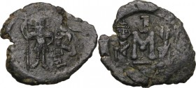 Constans II, with Constantine IV (641-668). AE Follis. Syracuse mint. Struck 659-668. Constans, holding long cross with right hand, and Constantine IV...