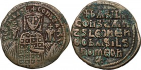Basil I the Macedonian, with Constantine and Leo VI (867-886). AE Follis. Constantinople mint. Struck 870-879. Crowned half-length figures of Basil, w...