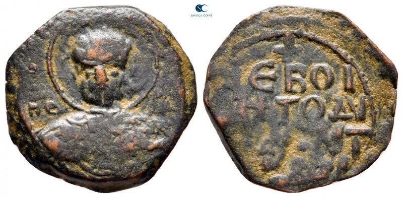 Tancred AD 1101-1103. Antioch
Follis Æ

19 mm, 3,36 g

Nimbate facing bust ...