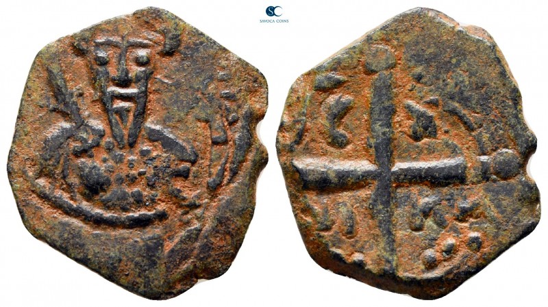 Tancred AD 1101-1103. Antioch
Follis Æ

20 mm, 3,07 g

Bust of Tancred faci...