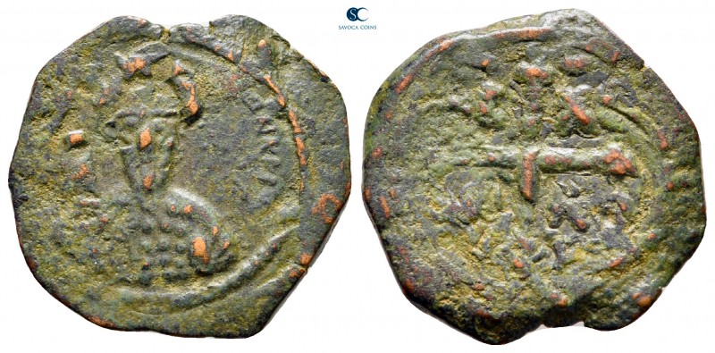 Tancred AD 1101-1103. Antioch
Follis Æ

22 mm, 3,46 g

Bust of Tancred faci...