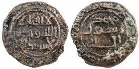 UMAYYAD: AE fals (1.06g), al-Daybul, AH117, A-199D, citing the kalima divided as usual on Umayyad copper coins, with the reverse marginal legend bism ...