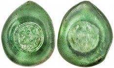 FATIMID: al- 'Aziz, 975-996, glass weight or jeton (5.83g), A-708, FGJ-49, legend just al-imam / nizâr, within ornamental circle; green, translucent, ...