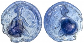 MEDIEVAL ISLAMIC EGYPT AND SYRIA: glass vessel stamp (5.94g), translucent blue, seated female figures, legs crossed, holding what appears to be a glas...