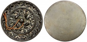 TANG: AE mirror (204.05g), 78mm, cast bronze mirror decorated with traditional sea beast pattern, VF, ex Dr. Harold H. Martinson Collection. 
Estimat...