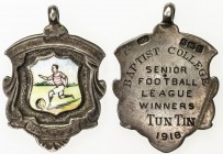 BURMA: AR medal (5.66g), 1918, 24 x 27mm, hand-painted enamel in the shape of a shield, depicting a player in profile dribbling a ball to the left in ...