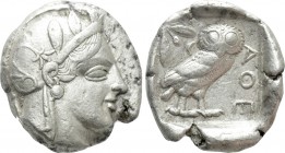 ATTICA. Athens. Tetradrachm (Circa 454-404 BC). 

Obv: Helmeted head of Athena right, with frontal eye.
Rev: AΘE. 
Owl standing right, head facing...