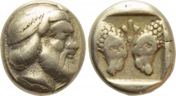 LESBOS. Mytilene. EL Hekte (Circa 454-428/7 BC).

Obv: Head of Silenos right, wearing tainia.
Rev: Confronted heads of two rams; palmette between; ...