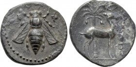 IONIA. Ephesos. Drachm (Circa 202-150 BC). Uncertain magistrate. 

Obv: Ε - Φ. 
Bee.
Rev: Stag standing right; palm tree in background.

Cf. SNG...