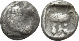 CARIA. Uncertain. Obol (5th century BC). 

Obv: Stylised head of griffin right.
Rev: Facing panther’s head within incuse square.

Cf. SNG Kayhan ...