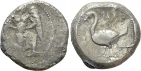 CILICIA. Mallos. Stater (Circa 440-390 BC). 

Obv: Winged male figure advancing right, holding solar disk.
Rev: ΜΑP. 
Swan standing left; fish to ...