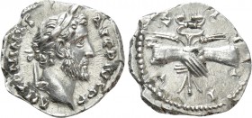 ANTONINUS PIUS (138-161). Denarius. Rome. 

Obv: ANTONINVS AVG PIVS P P. 
Laureate head right.
Rev: COS IIII. 
Clasped hands over caduceus and gr...