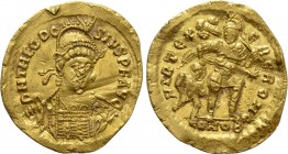 THEODOSIUS II (402-450). GOLD Solidus. Constantinople. 

Obv: D N THEODOSIVS P F AVG. 
Helmeted and cuirassed bust facing slightly right, holding s...