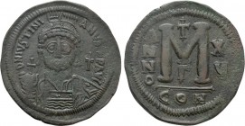 JUSTINIAN I (527-565). Follis. Constantinople. Dated RY 15 (541/2). 

Obv: D N IVSTINIANVS P P AVG. 
Helmeted and cuirassed bust facing, holding gl...