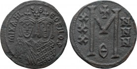 MICHAEL II THE AMORIAN with THEOPHILUS (820-829). Follis. Constantinople. 

Obv: MIXAHL S ΘЄOFILOS. 
Crowned facing busts of Michael and Theophilus...