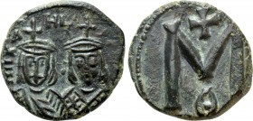 MICHAEL II AMORIANUS (820-829). Follis. Syracuse. 

Obv: MIXAHL S ΘEOF. 
Crowned facing busts of Michael, with short beard and chlamys to left, and...