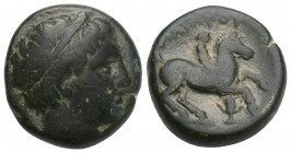 Greek Kings of Macedon. Uncertain mint. Philip II. 359-336 BC. Bronze Æ 16.3mm., 6.3g.
 Diademed head of Apollo right / Youth on horseback riding righ...