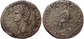 NERO CLAUDIUS DRUSUS, Sest, Bust l./Claudius std l, on pile of arms (weapons, not limbs); VF for wear, with strong portrait detail, lt to moderate sur...