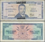 Burundi: 100 Francs 1965 with black overprint P. 17a, used with center fold, light stain in paper, no holes, still strong paper, condition: F+.
 [tax...