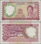 Tanzania: Bank of Tanzania 100 Shillings ND(1966), P.5b, still nice condition with a few folds and tiny pinholes at lower right, Condition: VF.
 [plu...
