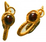 Ancient Roman Gold Earrring with a jasper stone on bezel, c. 1st-3rd century AD.
Condition: Very Fine


Weight: 1,1 gram
Diameter: 15,1 mm