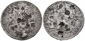 Charles III (1759-1788). 8 reales. 1786. México. FM. (Cal-1129). Ag. 26,69 g. Chop marks. VF. Est...90,00. 

SPANISH DESCRIPTION: Carlos III (1759-178...
