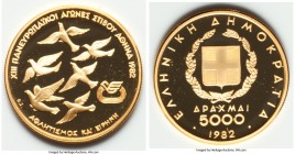 Republic gold Proof "XIII Pan-European Games" 5000 Drachmai 1982, KM144. Mintage: 50,000. Sold with original case of issue and COA #1569. AGW 0.3617 o...