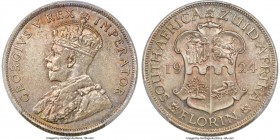 George V 2 Shillings (Florin) 1924 MS64+ PCGS, Pretoria mint, KM18, Hern-237. A spectacular example with mottled patination atop silky, pewter-coated ...