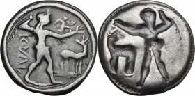 Greek Italy. Bruttium, Kaulonia. AR Stater, 500-480 BC. Obv. Apollo, naked, walking right, with palm branch in left hand and right arm outstreached wi...