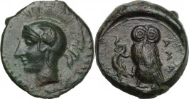 Sicily. Kamarina. AE Tetras, 425-405 BC. Obv. Helmeted head of Athena left. Rev. Owl standing left, head facing, holding lizard; in exergue, [three pe...