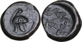Sicily. Tauromenion. Campanian Mercenaries, c. 354-344 BC. AE 12.5 mm. Obv. Campanian helmet. Rev. Monogram of TA combined with KAM, within olive wrea...