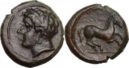 Punic Sicily. Uncertain mint. AE 16 mm. c. 400-350 BC. Obv. Wreathed head of female left, wearing earring. Rev. Horse prancing right, on exergual line...