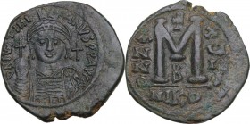Justinian I (527-565). AE Follis, Nicomedia mint, RY 18 (544/5 AD). Obv. D N IVSTINI-ANVS P P AVG. Helmeted, pearl-diademed and cuirassed bust facing,...