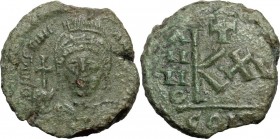 Justinian I (527-565). AE Half Follis. Sicilian mint(?) Dated RY 15 (541/2 AD). Obv. DN IVSTINIANVS PP AG. Helmeted and cuirassed bust facing, holding...