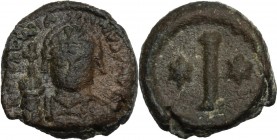 Justinian I (527-565). AE Decanummium, Rome mint. Obv. DN IVSTINIANVS P AVG. Helmeted and cuirassed bust facing, holding globes crucifer and shield. R...