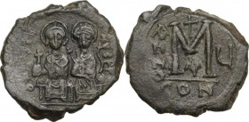 Justin II (565-578). AE Follis, Constantinople mint, RY 5 (569/70 AD). Obv. Justin and Sophia seated facing on double throne. Rev. Large M between A/N...