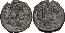 Justin II (565-578). AE Follis, Nicomedia mint, RY 9 (573/4 AD). Obv. D N IVSTINVS P P AV. Justin and Sophia enthroned facing, both nimbate and crowne...