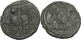 Justin II (565-578). AE Half Follis, Rome mint. Obv. Justin and Sophia seated facing on double throne; the emperor holds globus cruciger, the empress ...
