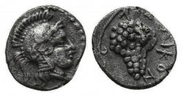 CILICIA, Soloi. Circa 350-330 BC. Obol. Head of Athena to right, wearing crested Corinthian helmet. Rev. ΣOΛEΩN Bunch of grapes on stalk with leaf and...