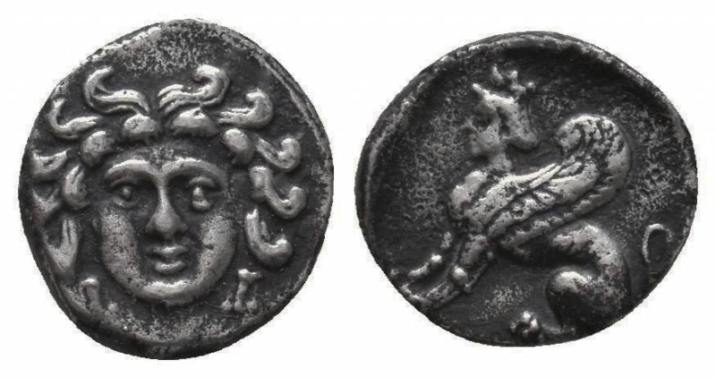 CILICIA, Uncertain. Circa 4th century BC. AR Obol. Gorgoneion / Sphinx seated le...