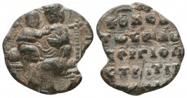 Byzantine lead seal of Gregorios patrikios and strategos
(ca 11th cent.).
Obverse: The Mother of God sitting on a backed decorated throne, facial and ...