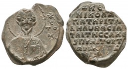 Byzantine lead seal of Nicholaos patrikios, judge of the velon, in charge of the imperial sakkella and praetor, 
with the rare depiction of saint John...