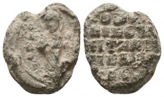 Byzantine lead seal of Thomas (?) officer 
(11th cent.
Obverse: Saint Basileios (?) standing, facial, nimbate, wearing prelate's garments, blessing by...