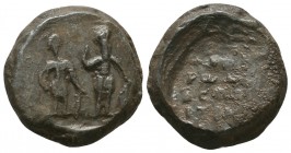661. Byzantine lead seal of N. protospatharios
(ca 11th cent.)
 

Obverse: Two uncertain military saints standing facing, wearing military dresses, ho...