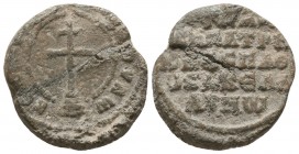 Byzantine lead seal of John patrikios, 
imperial protospatharios 
and akeladinos (?) 
(10th cent.)

Obverse: Patriarchal cross on four steps, circular...