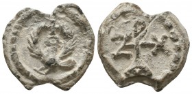 Byzantine lead seal of Zacharias officer
 (7th cent.)
Obverse: Eagle to right with open wings, cross over its head, wreath border.

Reverse: Cruciform...
