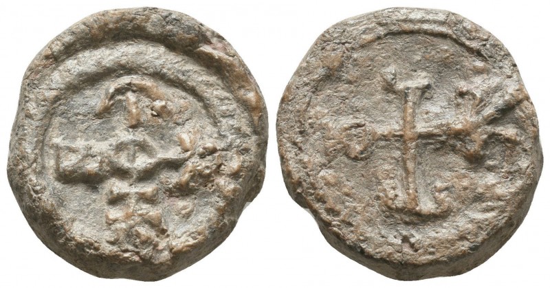 Byzantine lead seal of N. officer
 (6th/7th cent.)

Obverse: Cruciform monogram,...