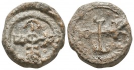 Byzantine lead seal of N. officer
 (6th/7th cent.)

Obverse: Cruciform monogram, resolved with certainty as ΘΕΟΤΟΚΕ ΒΟΗΘΕΙ (Mother of God, help), wrea...